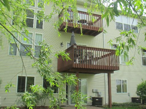 279 Ridge Road North Aurora, IL 60542 - Photo 16 of 16 a view of a house with a wooden deck and furniture