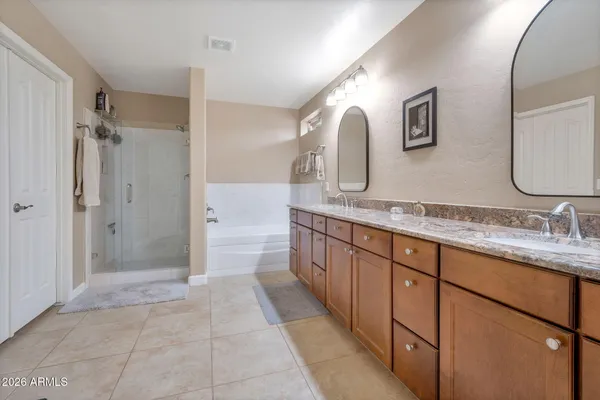 a bathroom with a granite countertop sink mirror and a