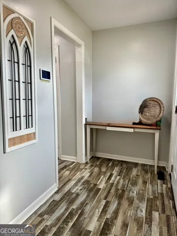 a view of a room with rack and wooden floor