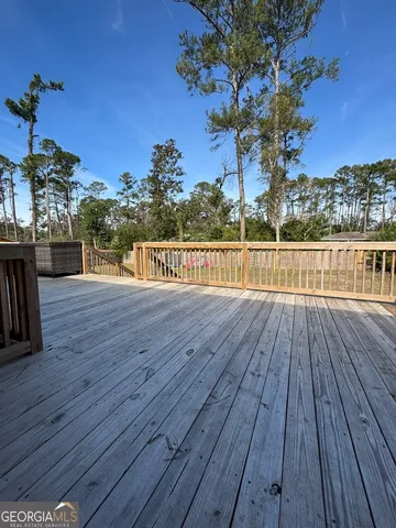 a view of a balcony with wooden floor