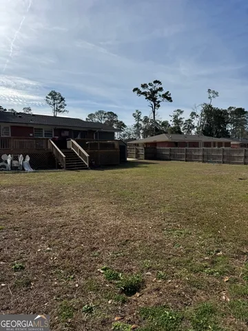 a view of a park with large trees