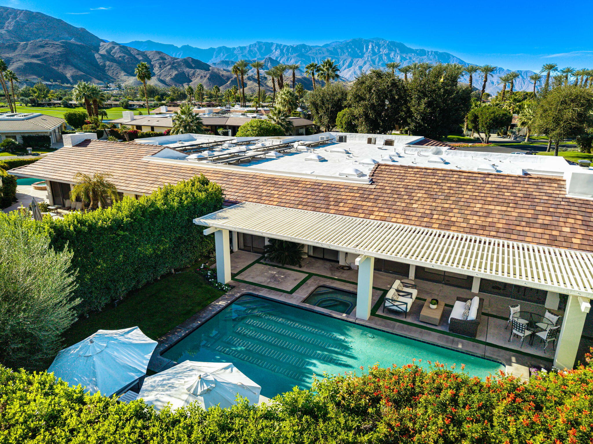 6 Exeter Court Rancho Mirage, CA 92270 - Photo 6 of 54 a view of a swimming pool with a yard