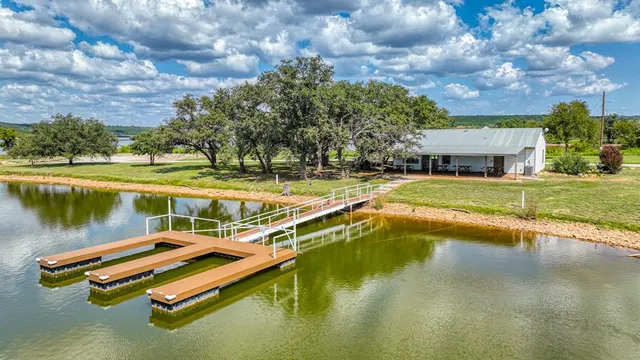 a view of a lake with a house in the background