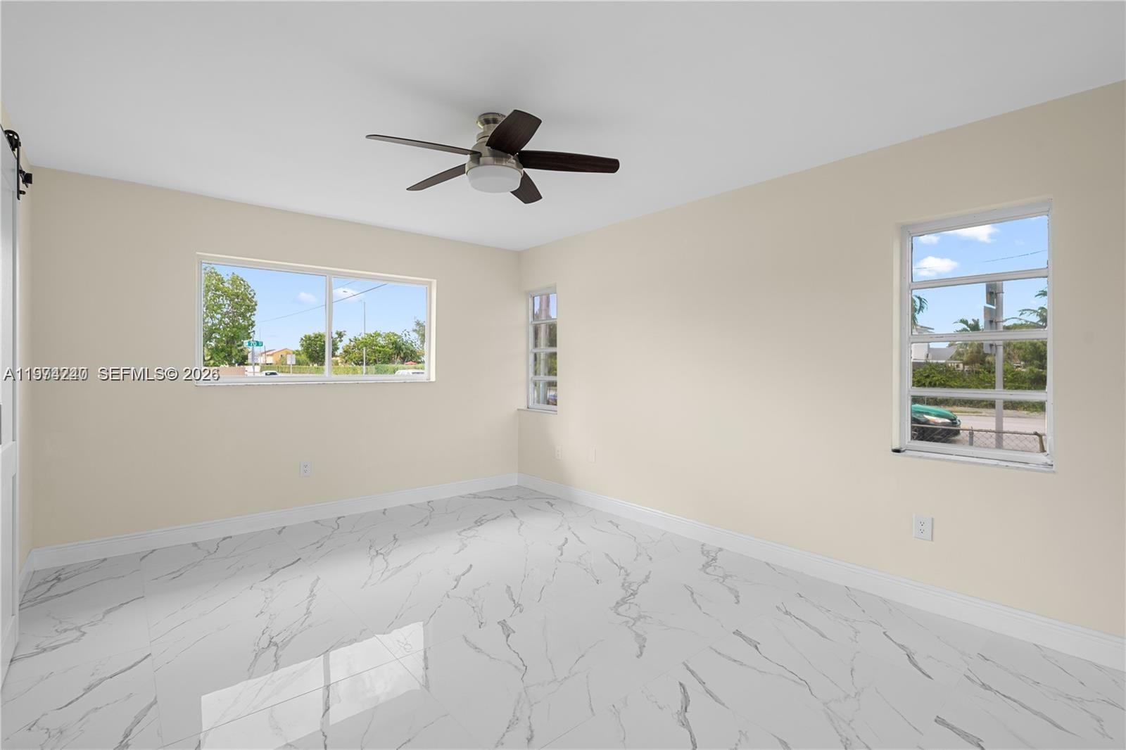 10700 Southwest 70th Street Miami, FL 33173 - Photo 12 of 19 a view of empty room with window