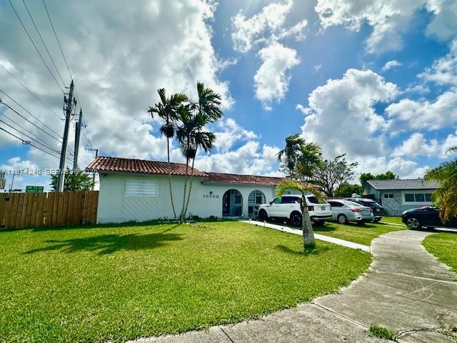 10700 Southwest 70th Street Miami, FL 33173 - Photo 2 of 19 a view of a house with a yard and sitting area
