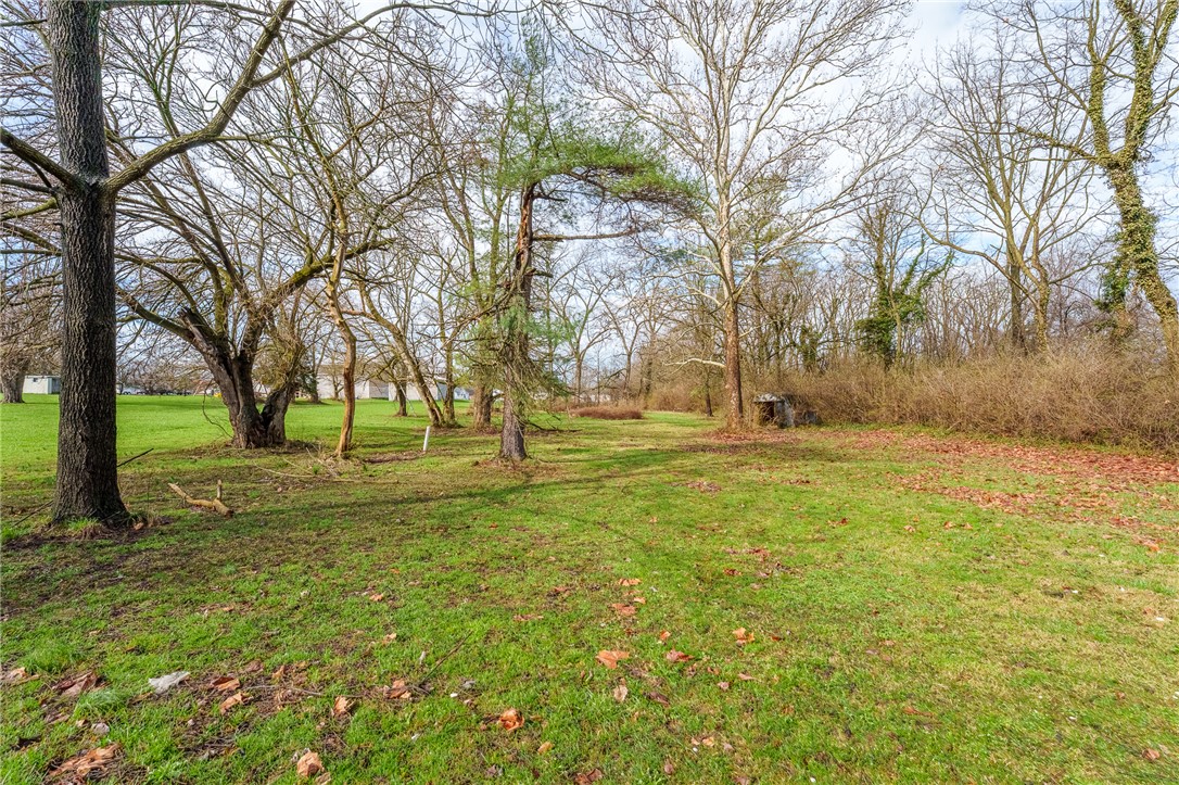 5839 Shaker Road Franklin, OH 45005 - Photo 14 of 18 A verdant, open lot with mature trees offers a serene natural setting.