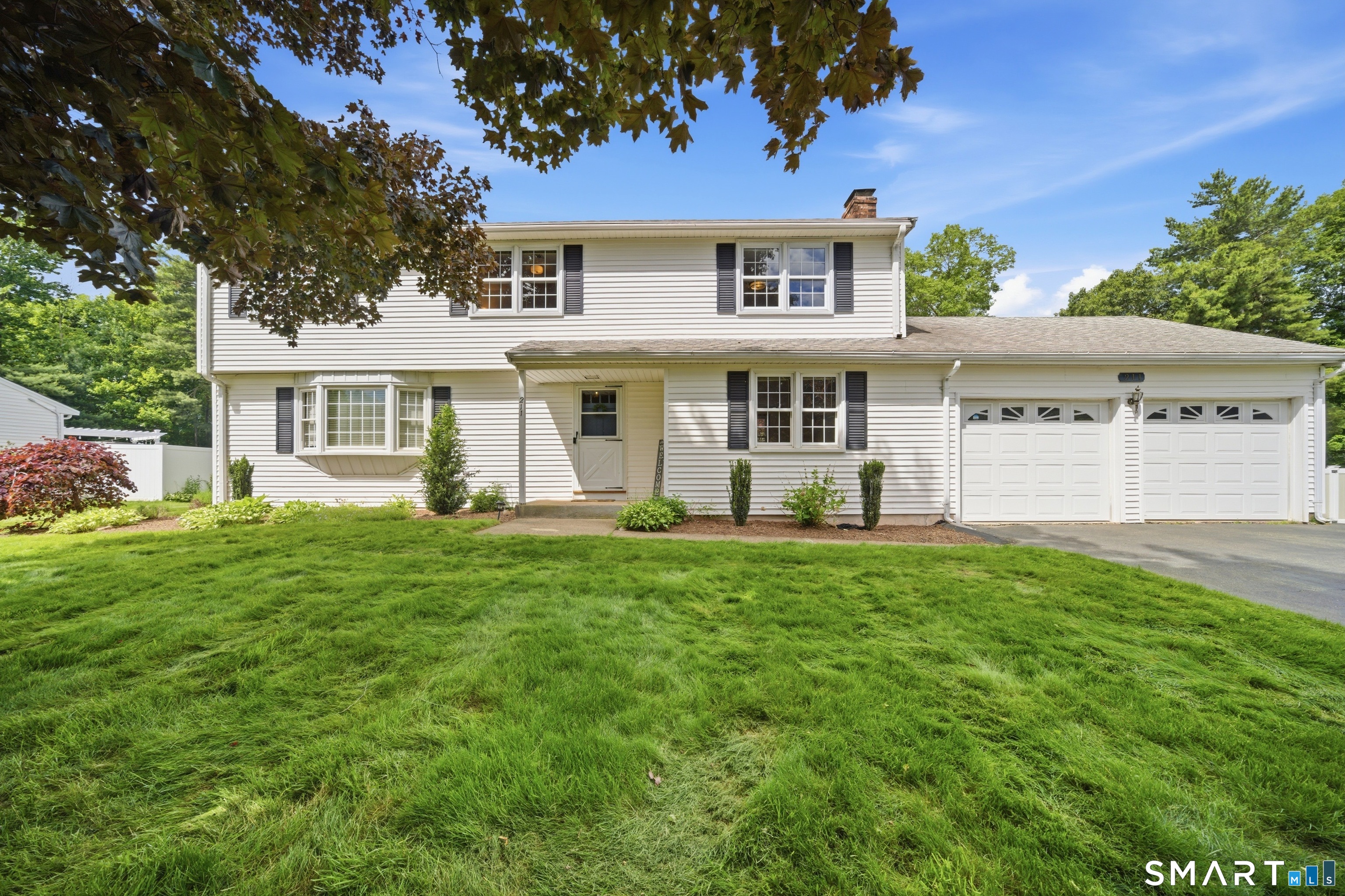 front view of a house with a yard