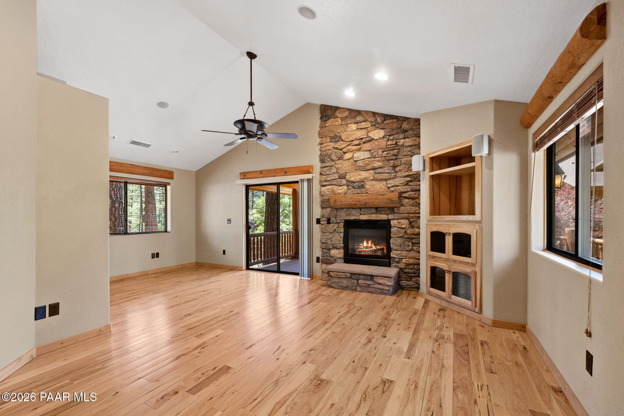 5140 East Charcoal Kiln Road Prescott, AZ 86303 - Photo 122 of 140 a view of empty room with a fireplace and wooden floor
