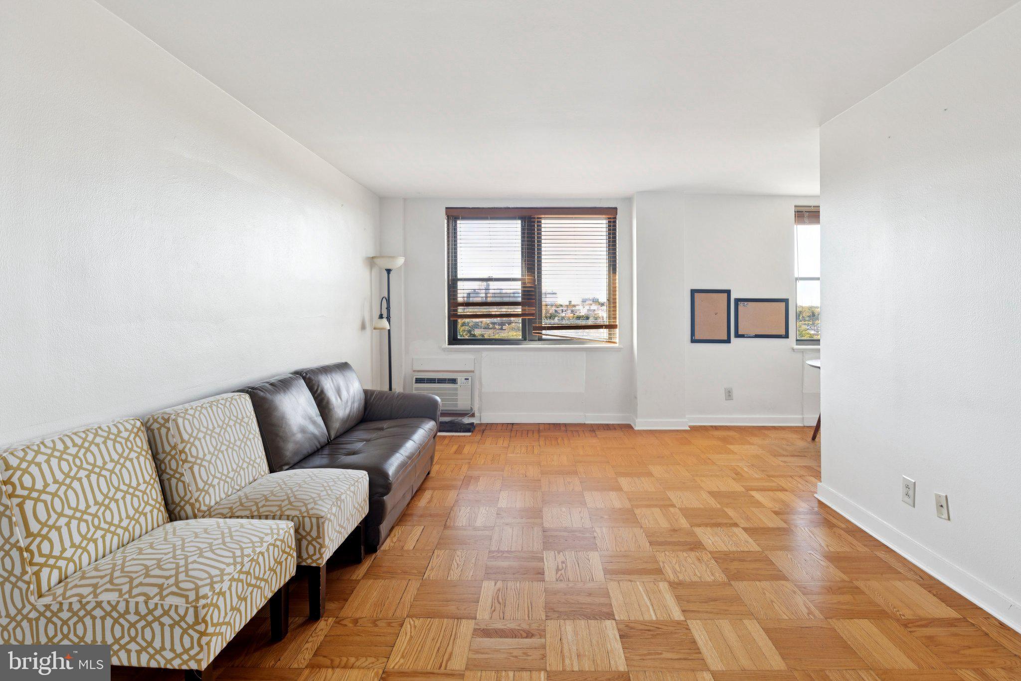 2601 Pennsylvania Avenue, Unit 848 Philadelphia, PA 19130 - Photo 2 of 12 a view of livingroom with furniture and windows