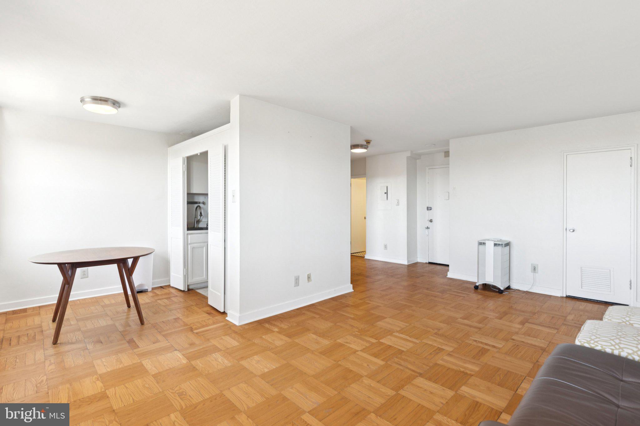 2601 Pennsylvania Avenue, Unit 848 Philadelphia, PA 19130 - Photo 3 of 12 a view of a room with a sink and a chair
