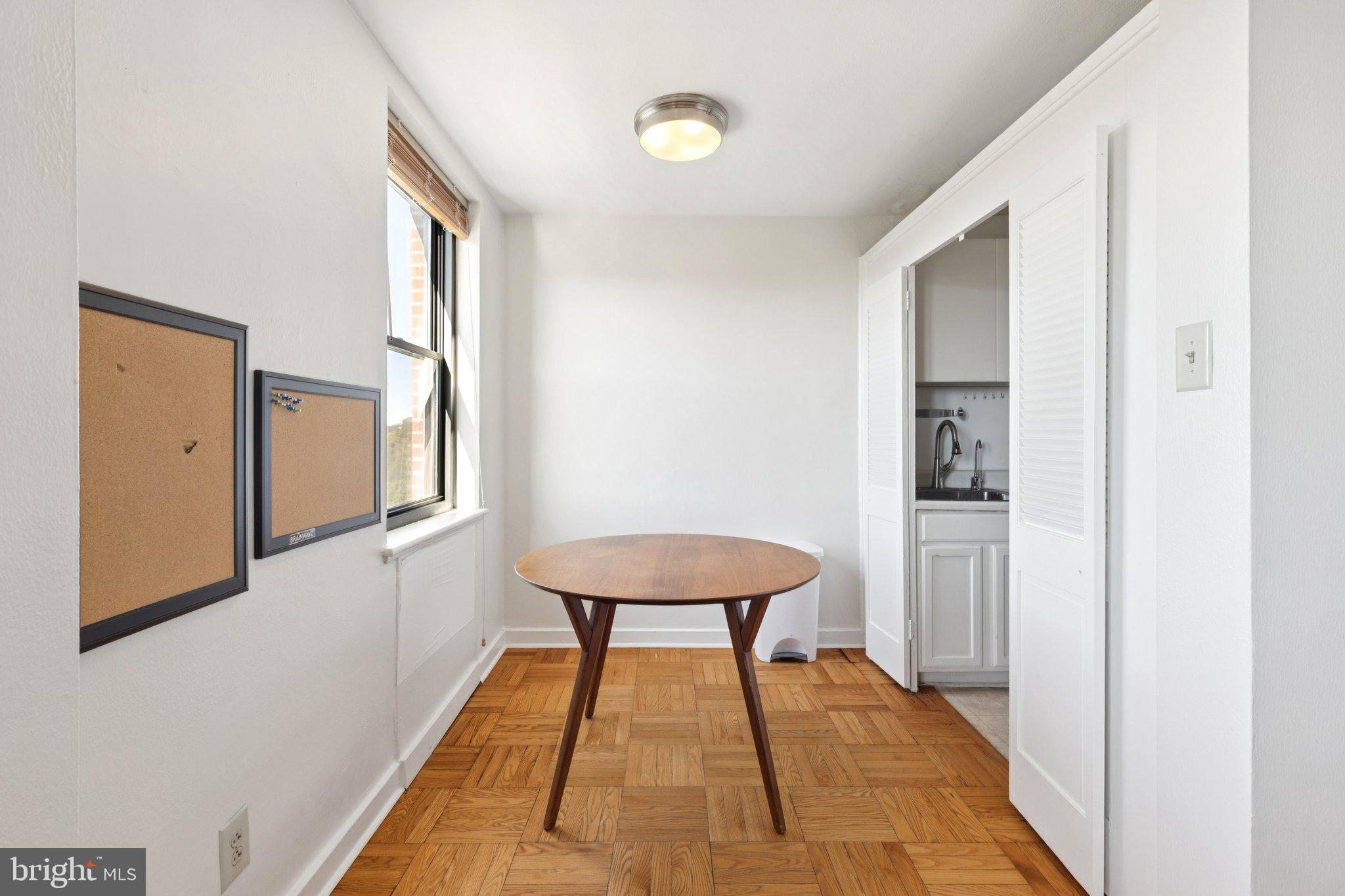 2601 Pennsylvania Avenue, Unit 848 Philadelphia, PA 19130 - Photo 4 of 12 a very nice looking room with a large window and a potted plant