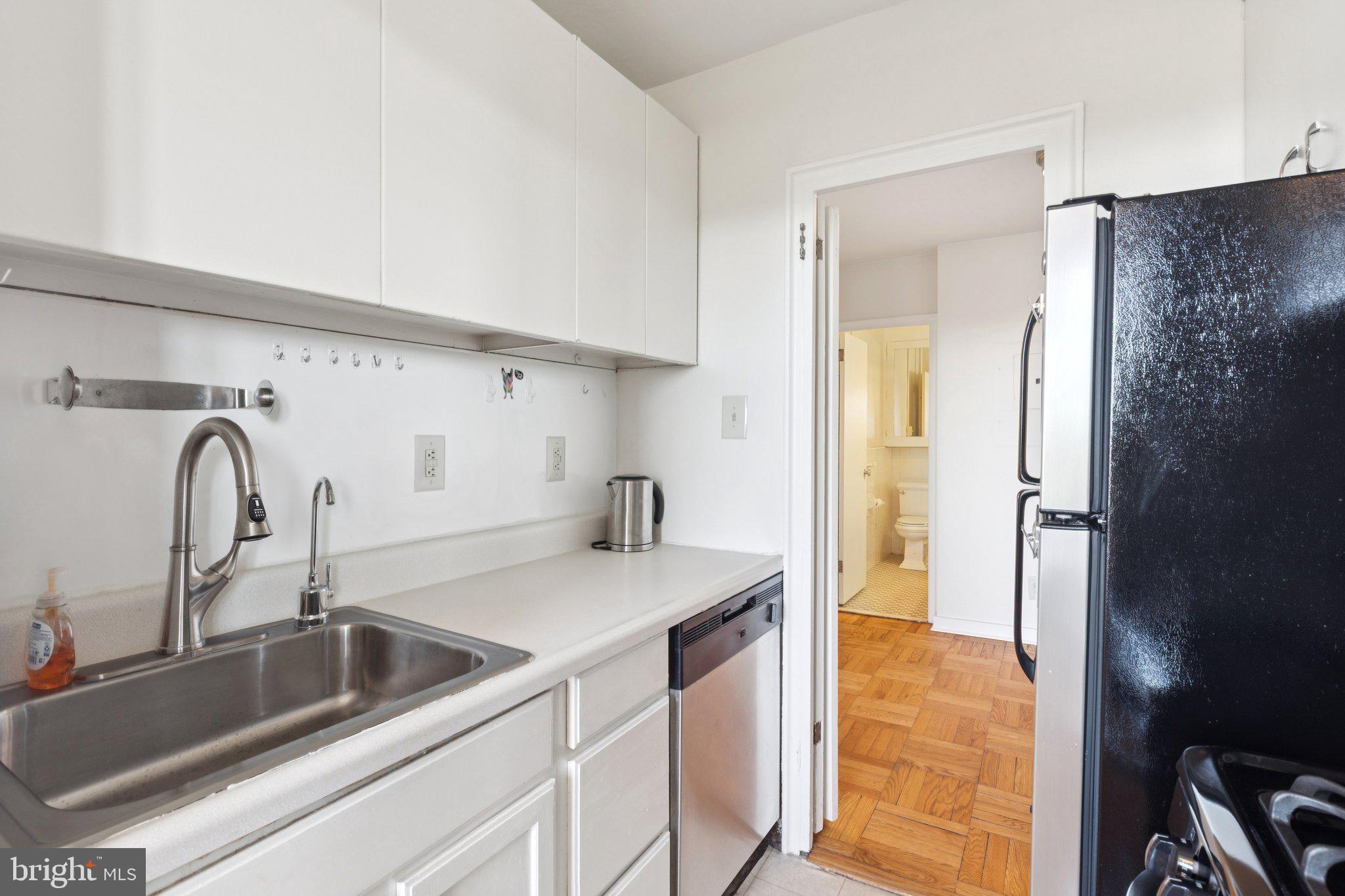 2601 Pennsylvania Avenue, Unit 848 Philadelphia, PA 19130 - Photo 6 of 12 a kitchen with a refrigerator and a sink