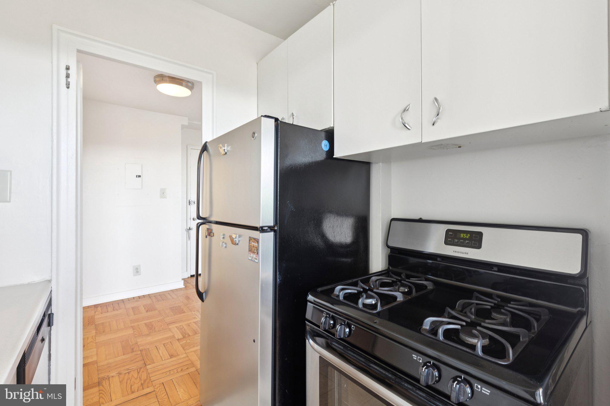 2601 Pennsylvania Avenue, Unit 848 Philadelphia, PA 19130 - Photo 7 of 12 a kitchen with a stove and a refrigerator