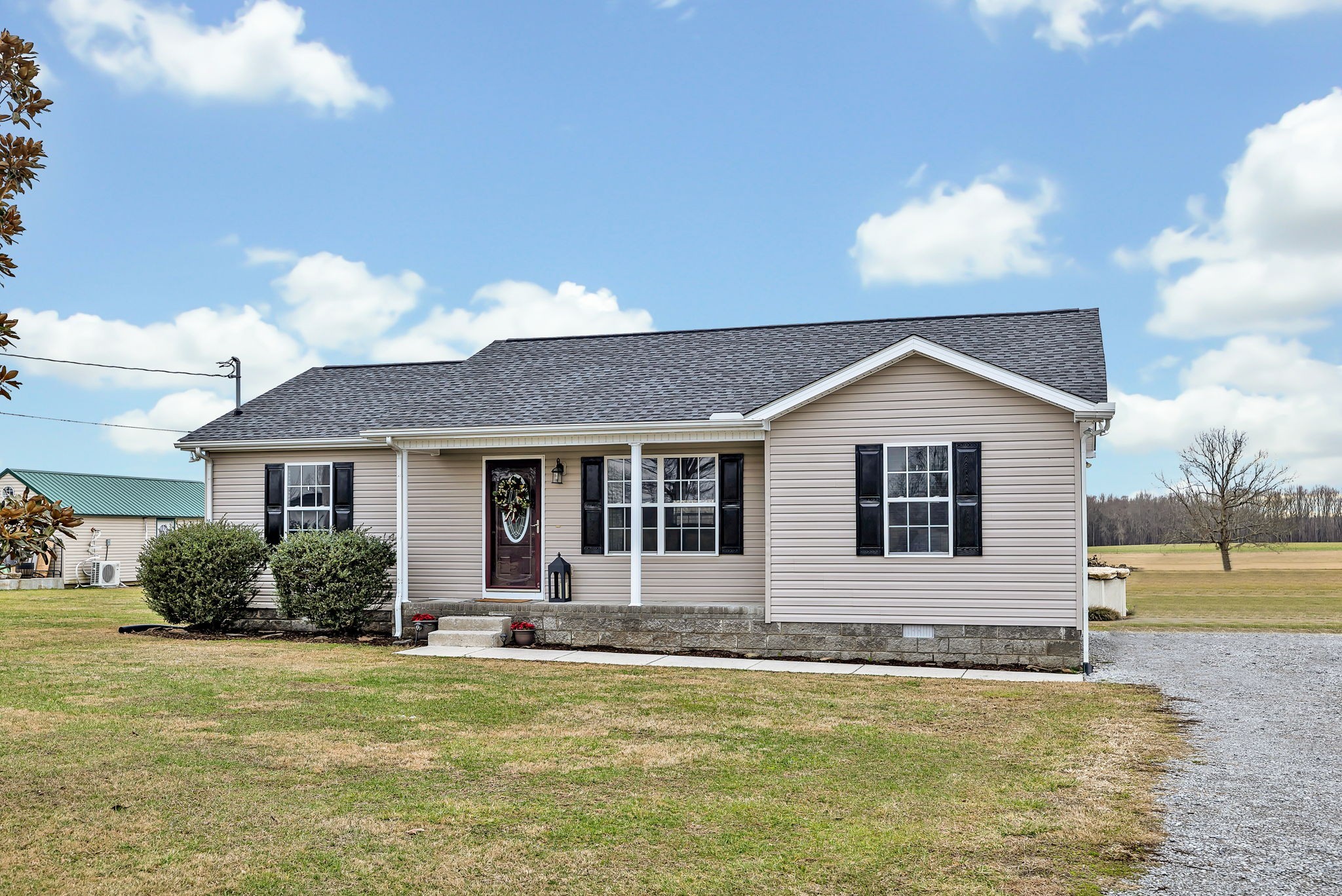 153 Spry Road Morrison, TN 37357 - Photo 1 of 19 a front view of a house with a yard
