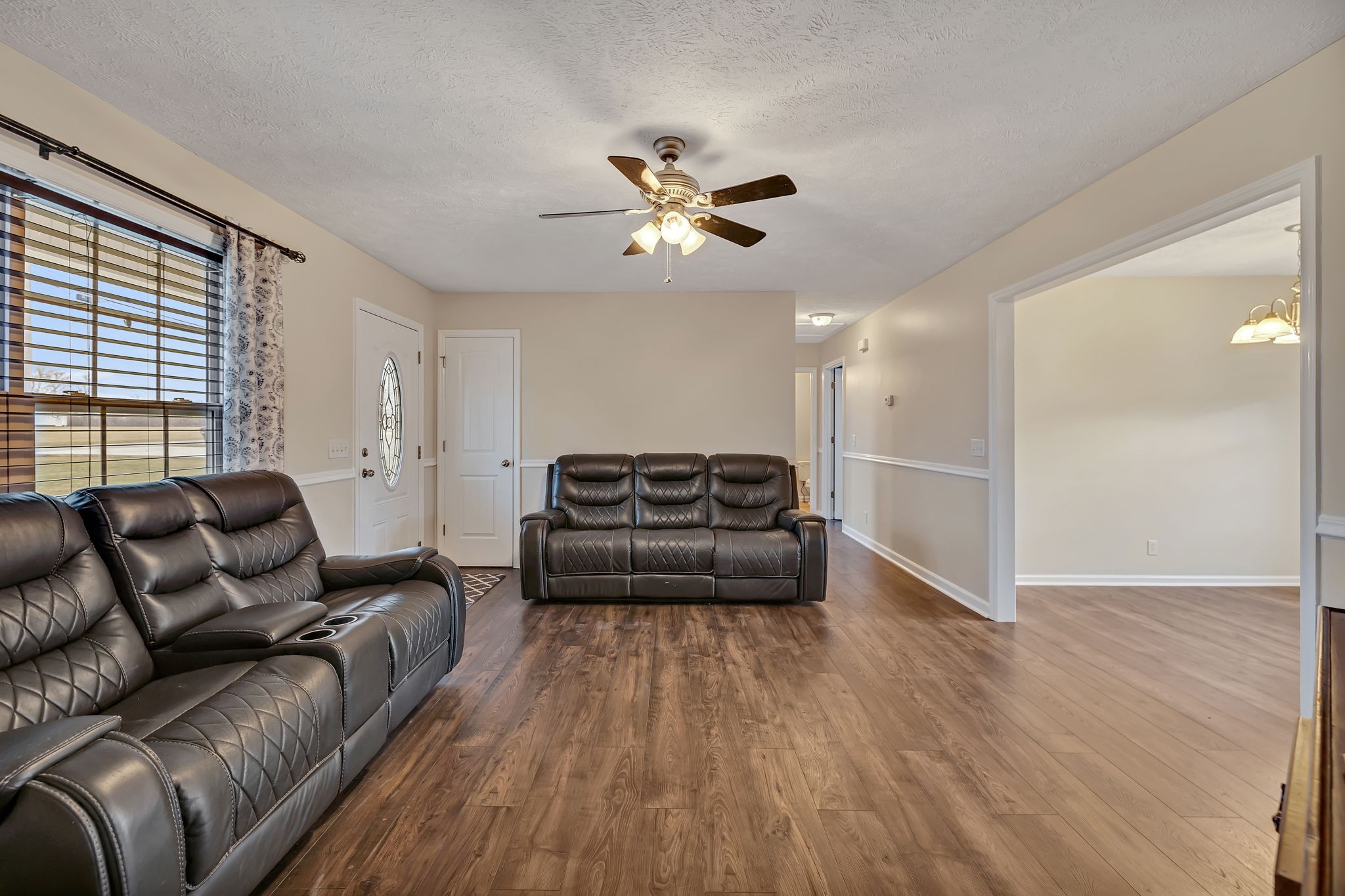 153 Spry Road Morrison, TN 37357 - Photo 2 of 19 a living room with furniture and a ceiling fan