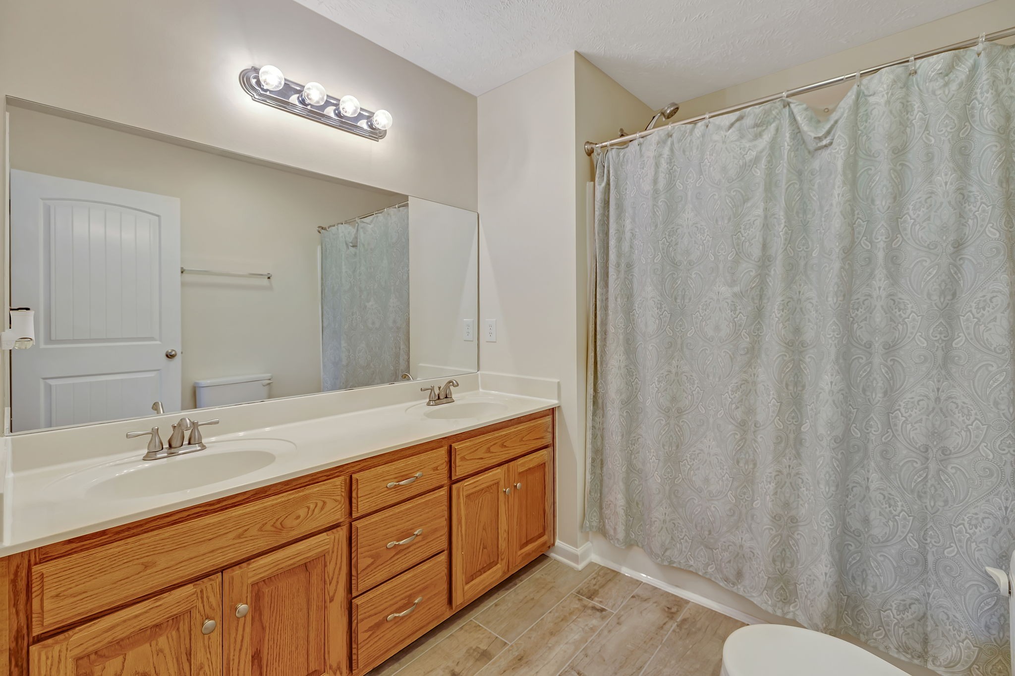 153 Spry Road Morrison, TN 37357 - Photo 10 of 19 a spacious bathroom with a double vanity sink and a mirror