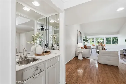 a view of living room with furniture and wooden floor