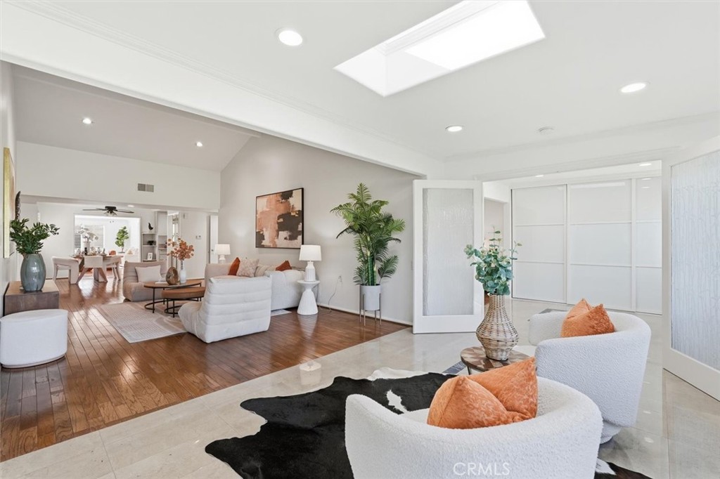 5512 West Paseo Del Lago, Unit C Laguna Woods, CA 92637 - Photo 20 of 45 a living room with furniture kitchen view and a potted plant