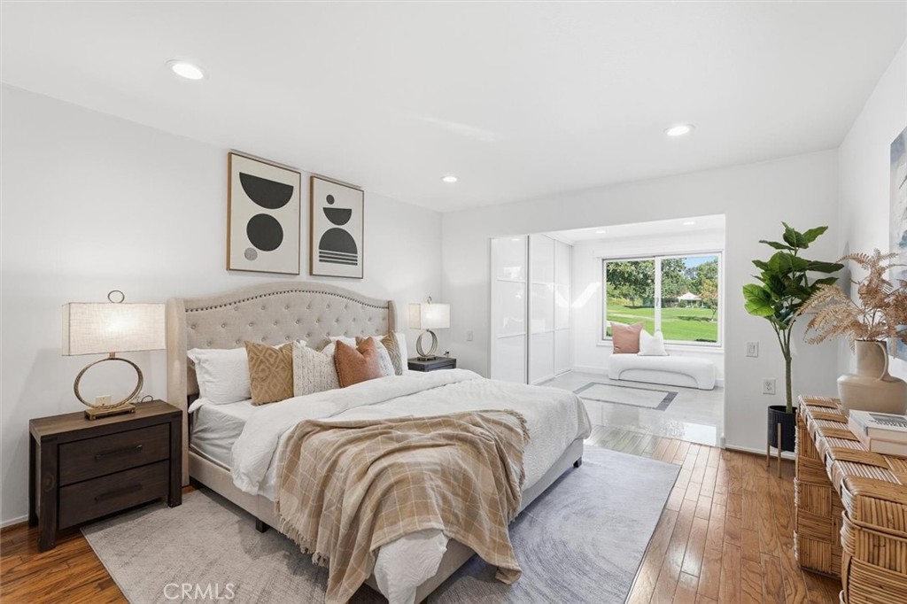 5512 West Paseo Del Lago, Unit C Laguna Woods, CA 92637 - Photo 22 of 45 a bedroom with a bed and a window