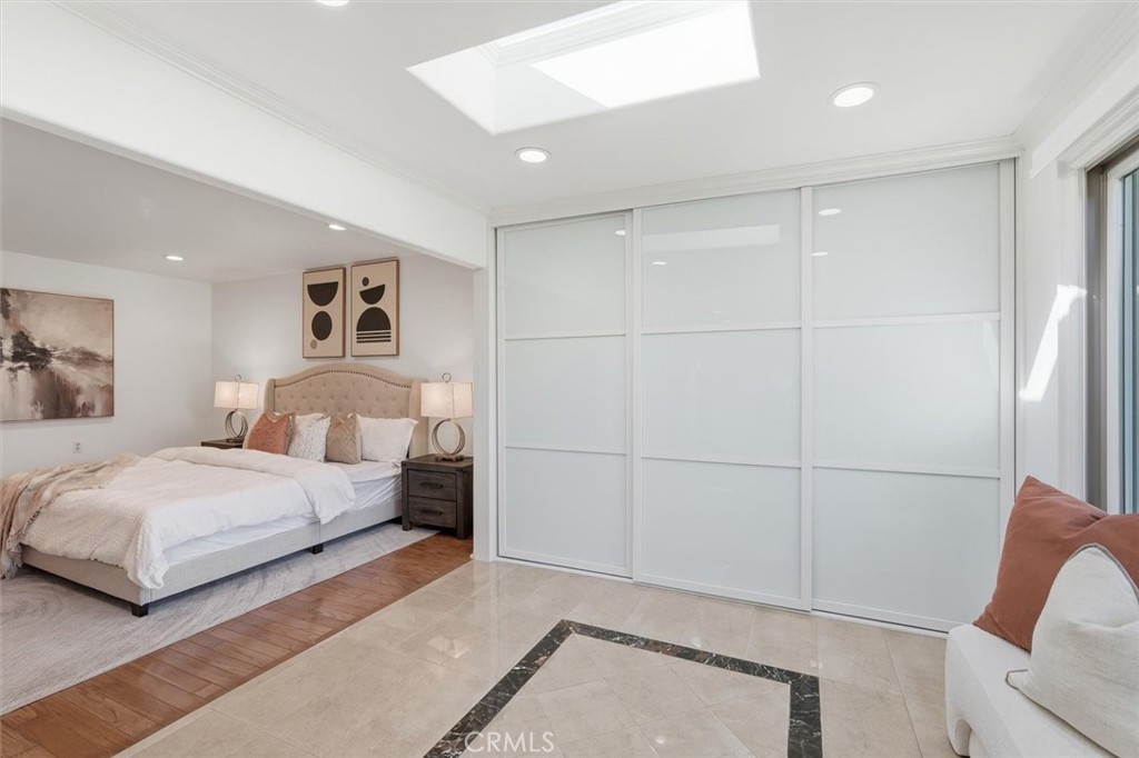 5512 West Paseo Del Lago, Unit C Laguna Woods, CA 92637 - Photo 23 of 45 a bedroom with a bed and a painting