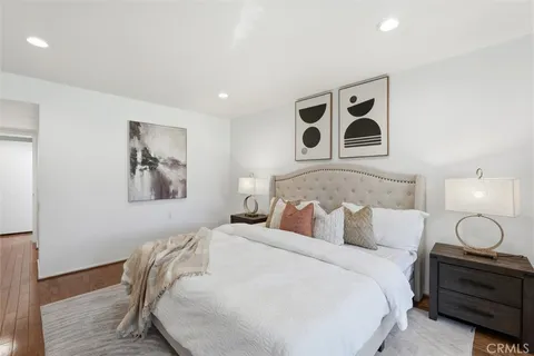 a bedroom with a bed and a couch