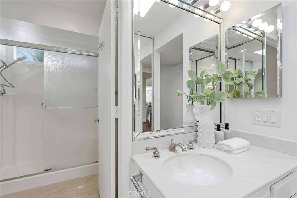5512 West Paseo Del Lago, Unit C Laguna Woods, CA 92637 - Photo 26 of 45 a bathroom with a sink and a mirror