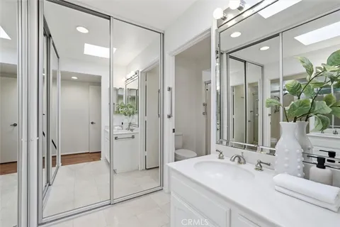 a very nice looking living room with a large window and dining table