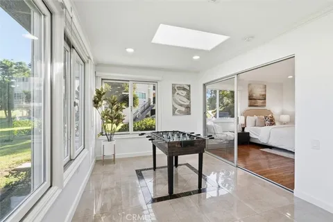 a bedroom with a large bed and a large window