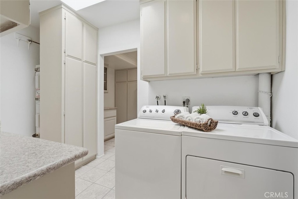 5512 West Paseo Del Lago, Unit C Laguna Woods, CA 92637 - Photo 34 of 45 a utility room with dryer and washer