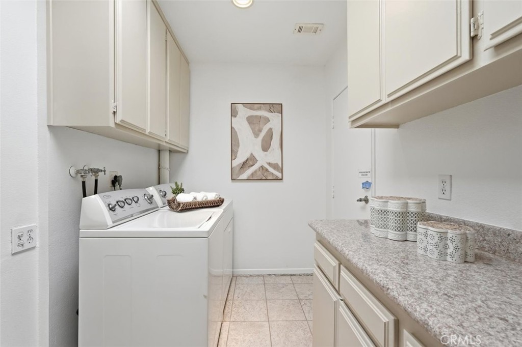 5512 West Paseo Del Lago, Unit C Laguna Woods, CA 92637 - Photo 35 of 45 a utility room with dryer and washer