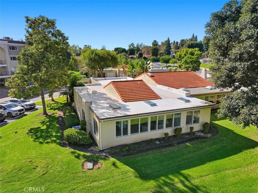 5512 West Paseo Del Lago, Unit C Laguna Woods, CA 92637 - Photo 37 of 45 a aerial view of a house with swimming pool and garden