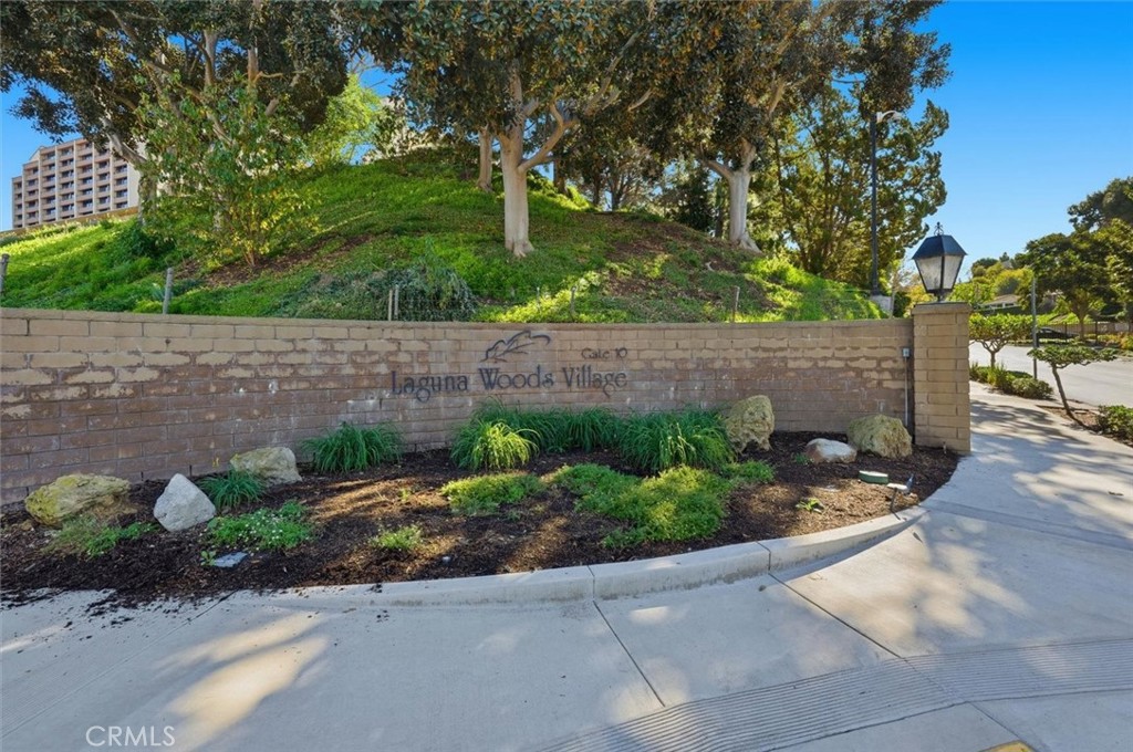 5512 West Paseo Del Lago, Unit C Laguna Woods, CA 92637 - Photo 39 of 45 a view of a garden with a bench
