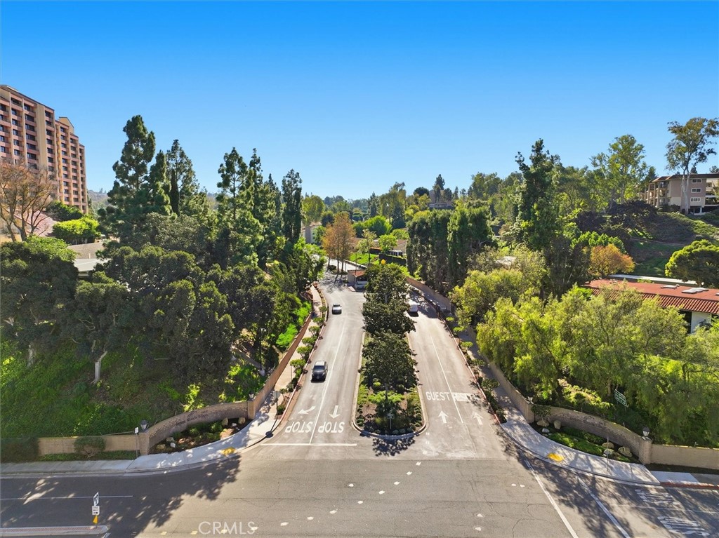 5512 West Paseo Del Lago, Unit C Laguna Woods, CA 92637 - Photo 40 of 45 a city view with tall trees