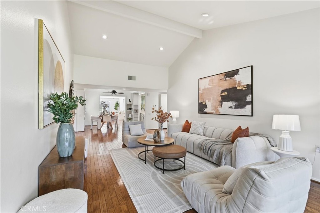 5512 West Paseo Del Lago, Unit C Laguna Woods, CA 92637 - Photo 5 of 45 a living room with furniture potted plant and a large mirror