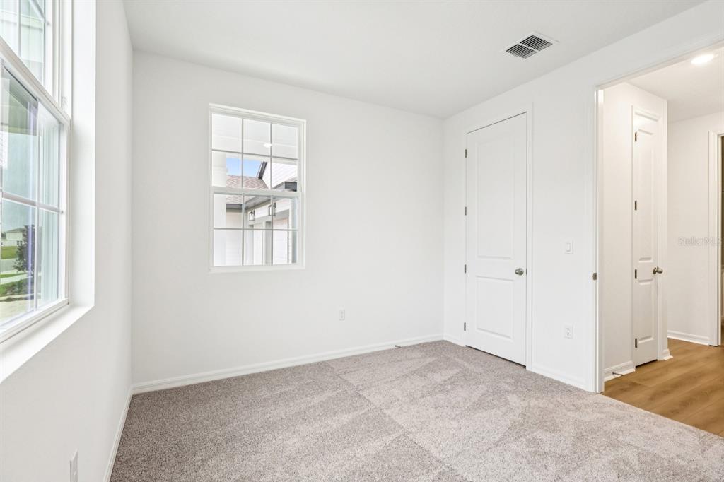 30158 Rustic Mill St Mount Mount Dora, FL 32757 - Photo 35 of 41 a view of an empty room with a window