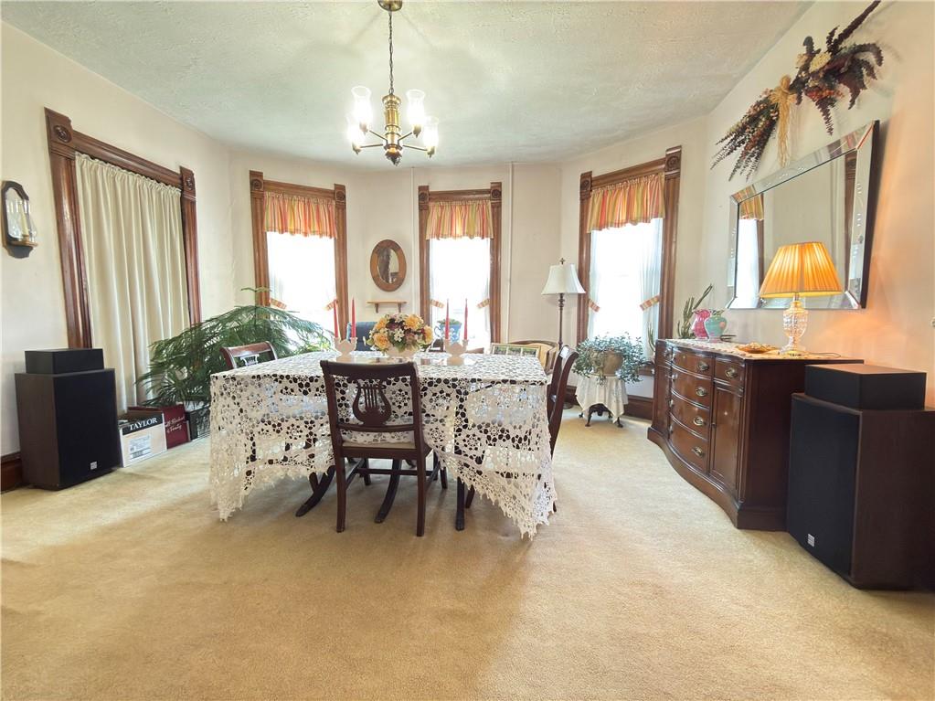 122 Coal Bank Road Greenville, PA 16125 - Photo 31 of 50 a view of a dining room with furniture and a chandelier