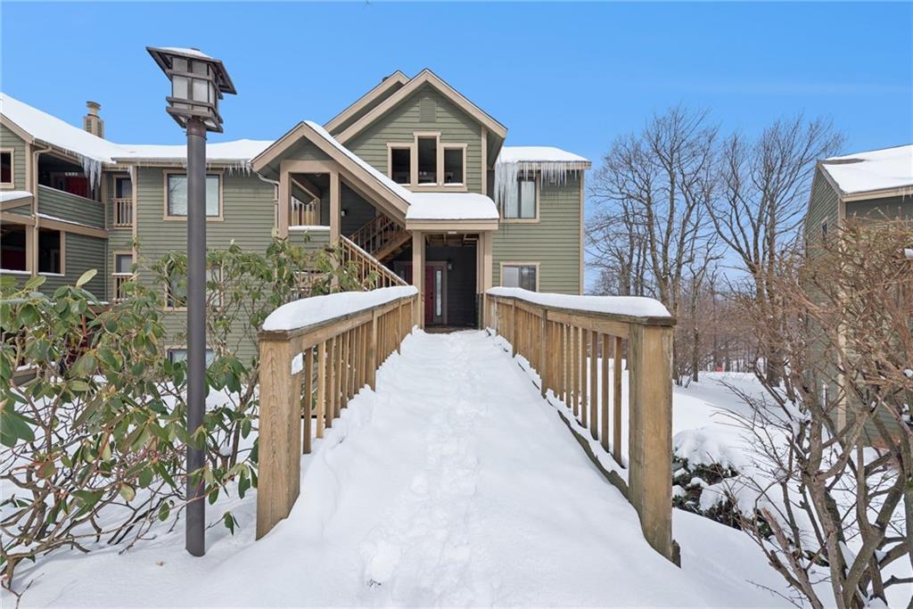 5228 Summit View Hidden Valley, PA 15502 - Photo 1 of 40 a view of a house with wooden fence and two windows