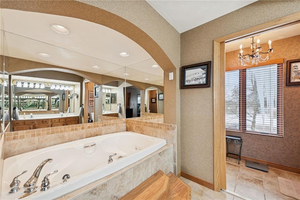 5228 Summit View Hidden Valley, PA 15502 - Photo 18 of 40 a bathroom with a bathtub and a shower