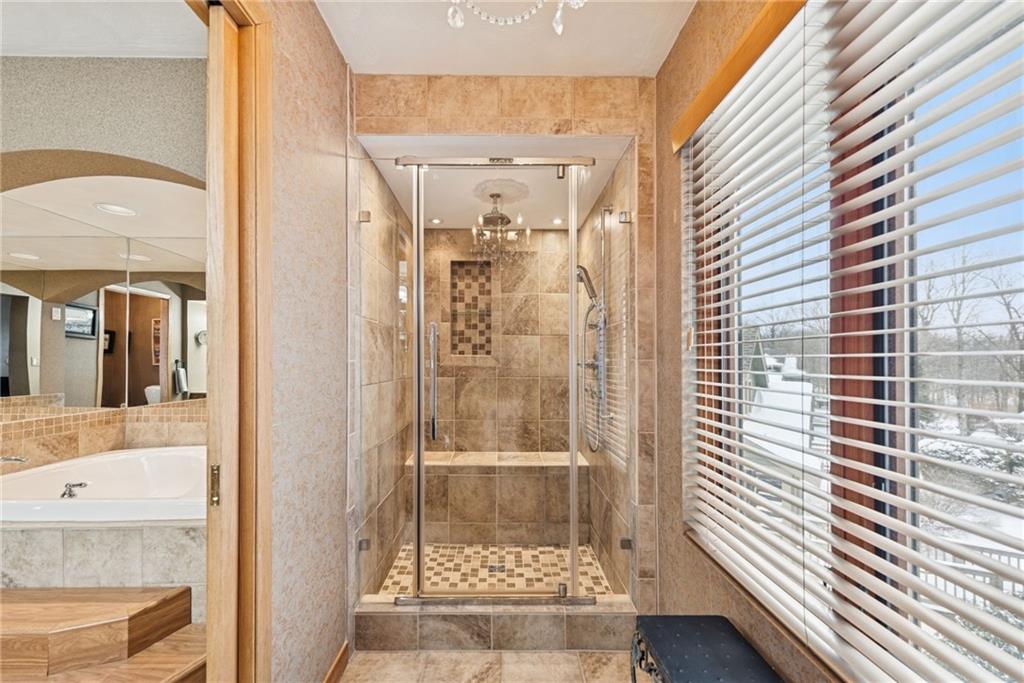 5228 Summit View Hidden Valley, PA 15502 - Photo 19 of 40 a bathroom with a glass shower door