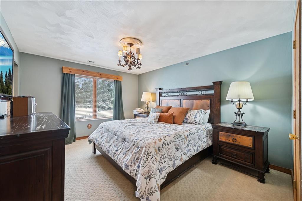 5228 Summit View Hidden Valley, PA 15502 - Photo 23 of 40 a bedroom with a bed and a table in it