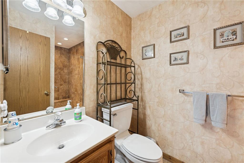 5228 Summit View Hidden Valley, PA 15502 - Photo 25 of 40 a bathroom with a sink a toilet a mirror and shower