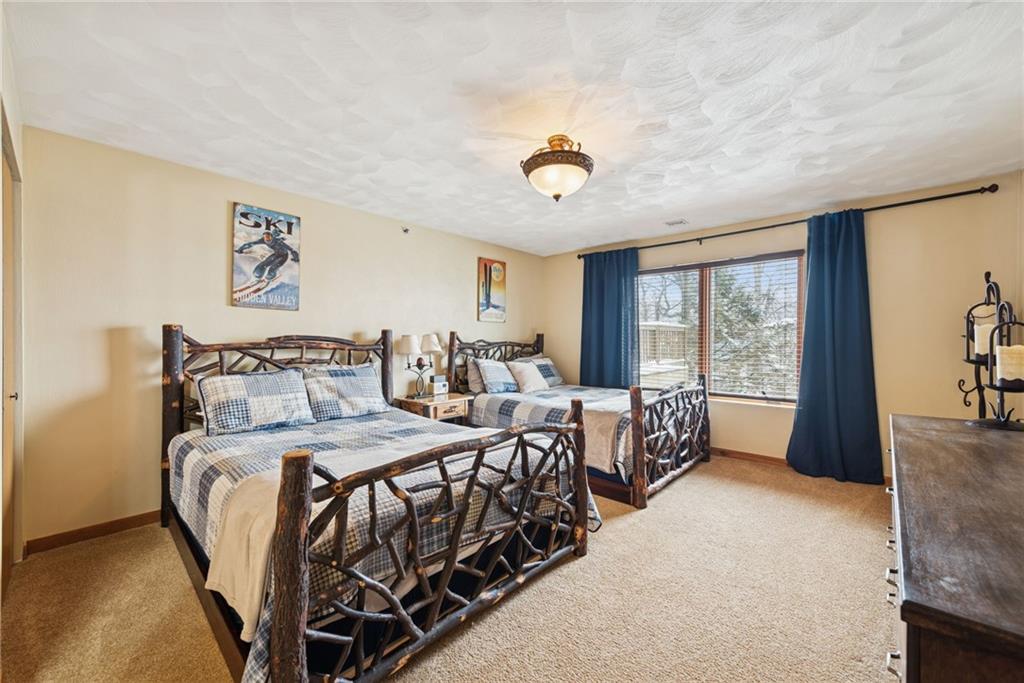 5228 Summit View Hidden Valley, PA 15502 - Photo 26 of 40 a bedroom with a bed and a large window