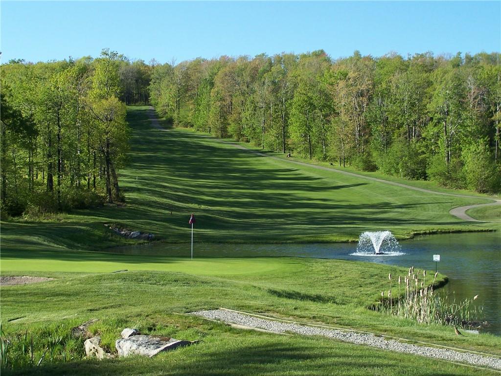 5228 Summit View Hidden Valley, PA 15502 - Photo 35 of 40 a backyard of a house with a garden and outdoor seating