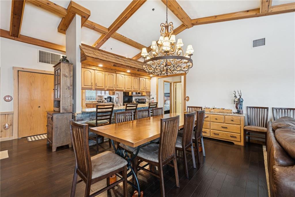 5228 Summit View Hidden Valley, PA 15502 - Photo 6 of 40 a dining room with furniture a chandelier and wooden floor