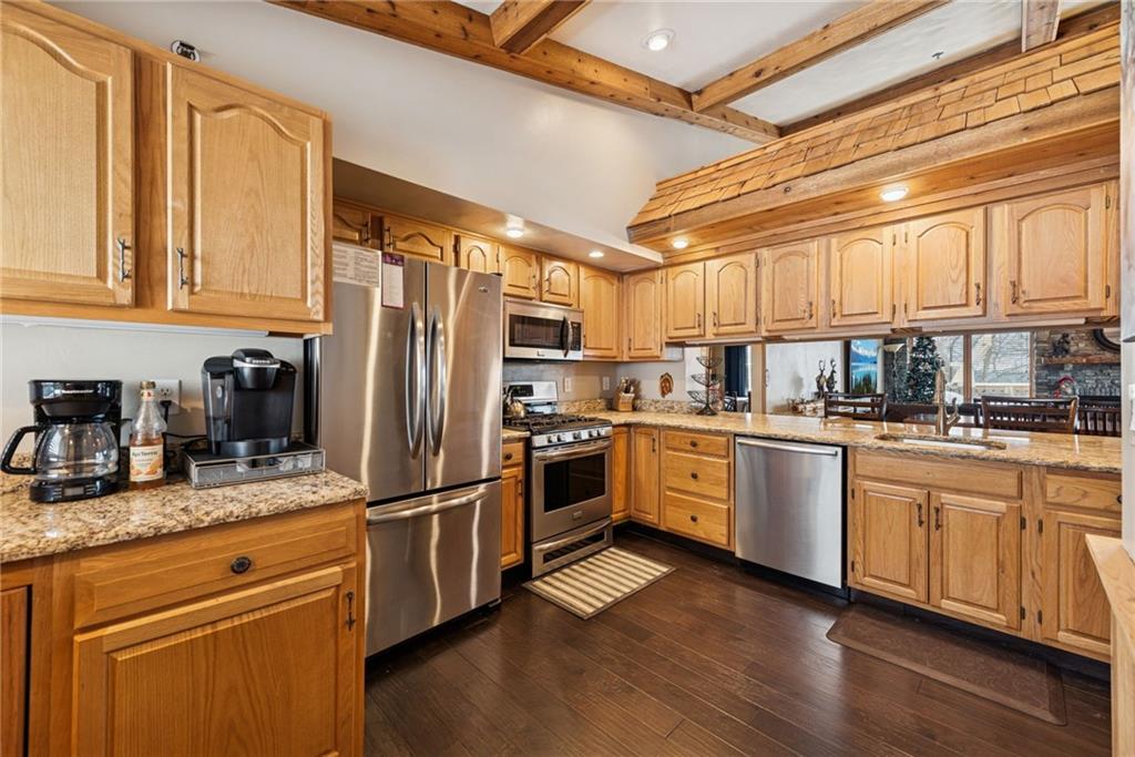 5228 Summit View Hidden Valley, PA 15502 - Photo 8 of 40 a kitchen with granite countertop stainless steel appliances a sink and counter space