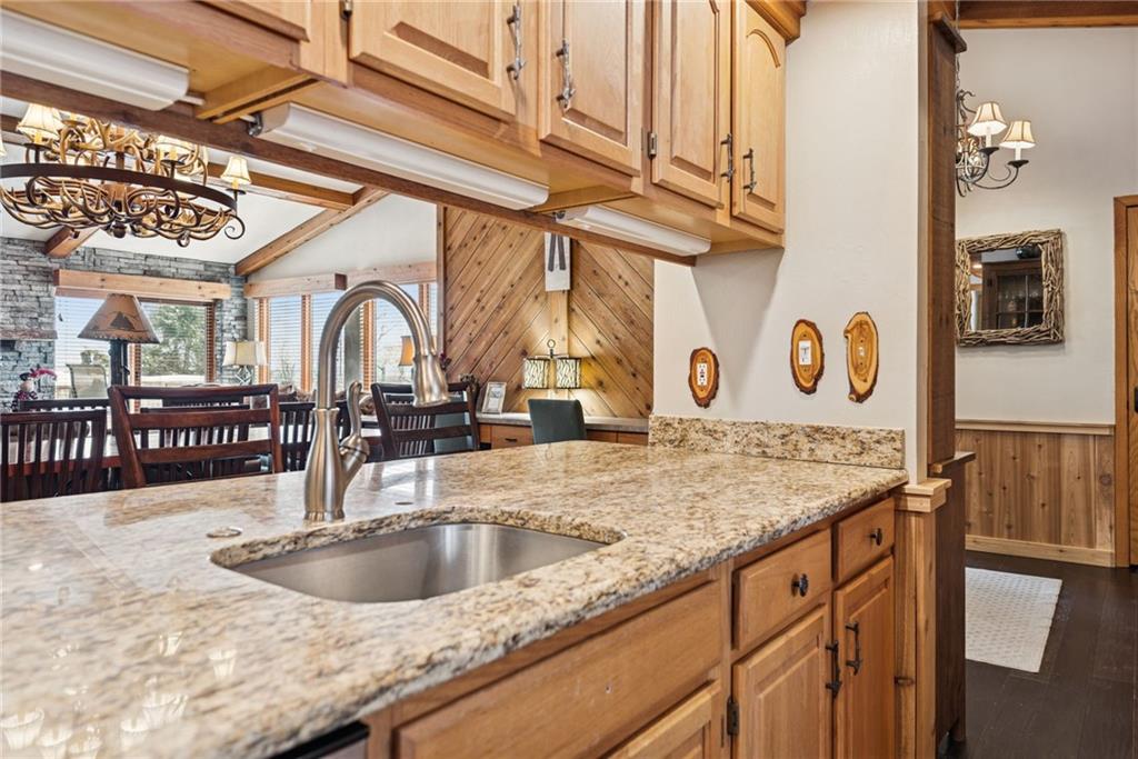 5228 Summit View Hidden Valley, PA 15502 - Photo 9 of 40 a kitchen with stainless steel appliances granite countertop a sink and cabinets