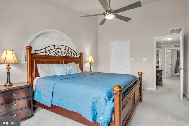 a bed room with a bed and a lamp