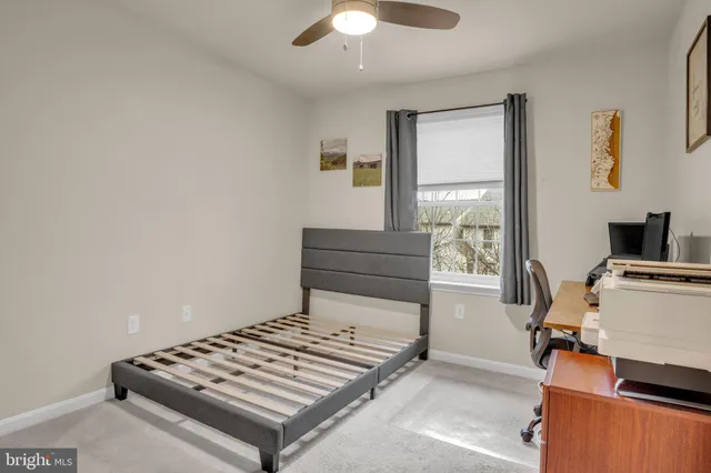 a bedroom with furniture and a window