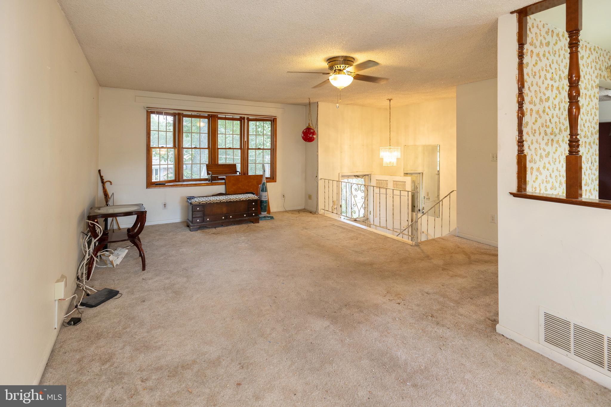 78 Diamond Avenue Pine Hill, NJ 08021 - Photo 16 of 36 a spacious bedroom with a bed and a chandelier