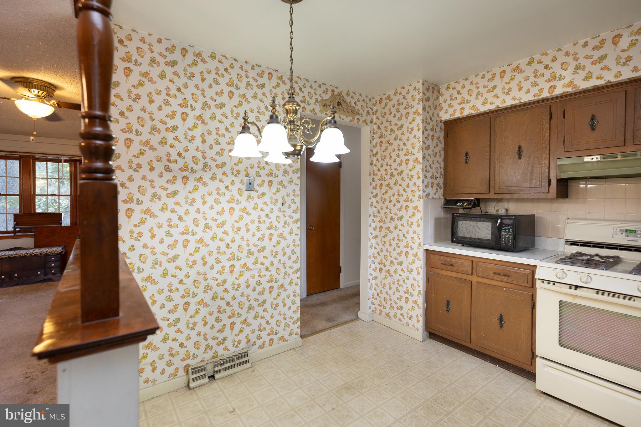 78 Diamond Avenue Pine Hill, NJ 08021 - Photo 21 of 36 a kitchen with a cabinets and white appliances